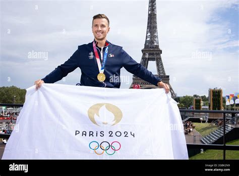 Gold Shooting Medalist Jean Quiquampoix Hold A Paris 2024 Flag As He