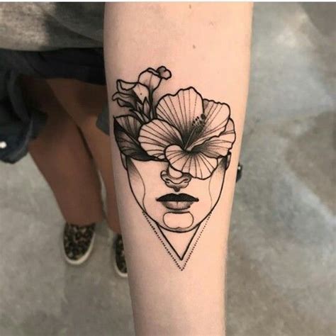 A Woman S Face And Flower Tattoo On The Left Arm With Black Ink