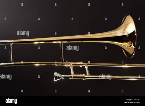 Golden Trombone Close Up With Dark Background Side View Horizontal