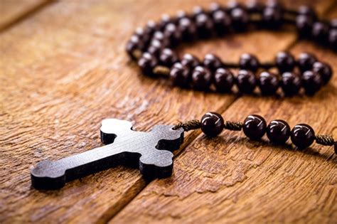 Premium Photo Wooden Cross Called A Rosary Christian Symbol Of Faith