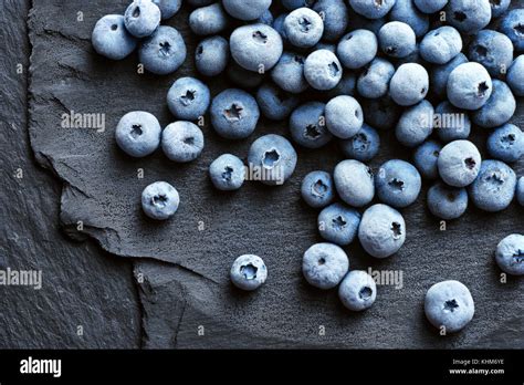 Frozen Blueberry On Black Slate Close Up Top View High Resolution