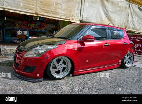 Suzuki Swift VVT modified car red Stock Photo - Alamy