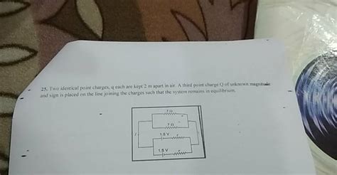 25 Two Identical Point Charges Q Each Are Kept 2 M Apart In Air A Thir