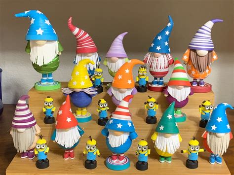 A Group Of Toy Figurines Sitting Next To Each Other On A Wooden Table