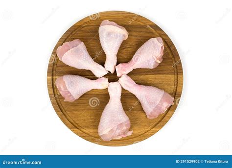 Delicious Raw Chicken Legs Or Drumsticks With Spices On A Wooden