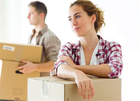 Free Photo Portrait Of Happy Couple Carrying Cardboard Boxes In New Home