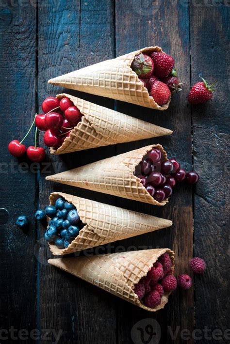 Juicy fruits in the ice cream cones 22970657 Stock Photo at Vecteezy