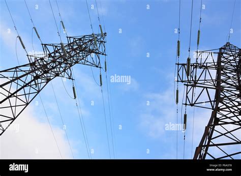 The Silhouette Of The Electricity Transmission Pylon In Daytime