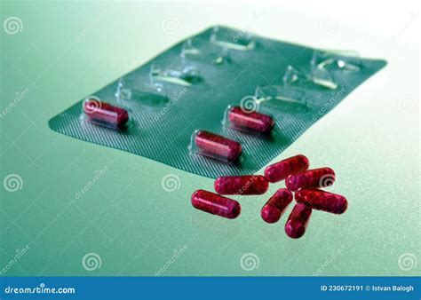 Purple Color Pills Capsules In Closeup View Silver Plastic Casing