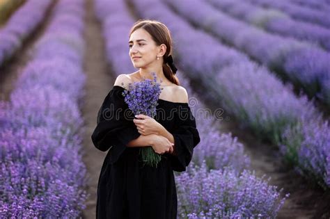 Young Romantic Woman With Healthy Natural Beauty Skin Holding Bouquet