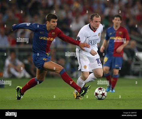 Manchester United S Wayne Rooney And Barcelona S Gerard Pique Left