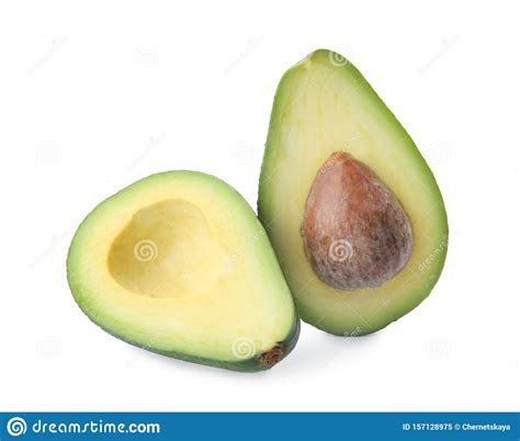 Halves De Aguacate Maduro Con Pozo En Blanco Imagen De Archivo Imagen