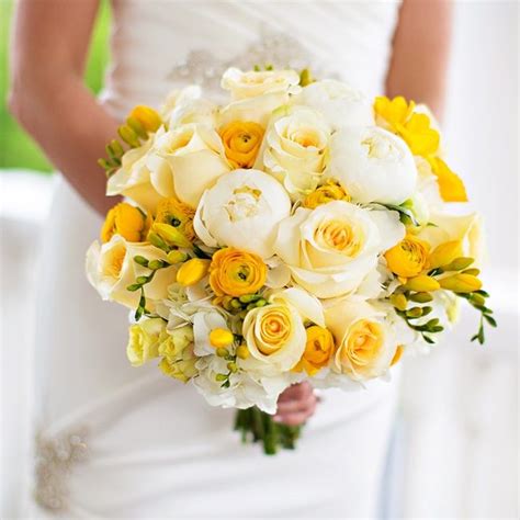 The Bridal Bouquet Was Full Of White Peonies And Roses And Yellow