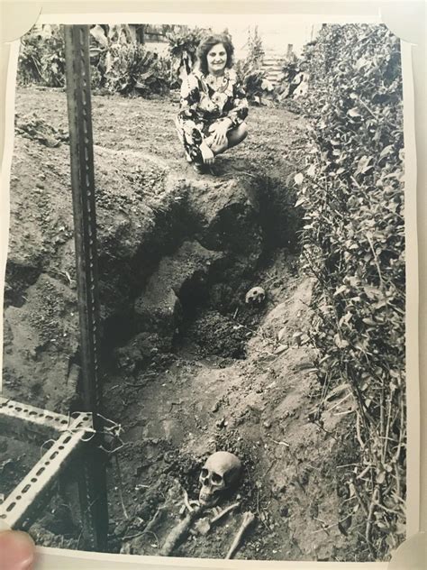 My aunt posing with the plague pit found in her garden. 70s. - Images