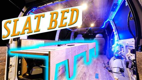 The Interior Of A Van With An Illuminated Sign That Says Slat Bed On It