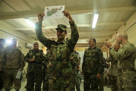 An Afghan National Army Soldier Holds His Certificate Nara And Dvids