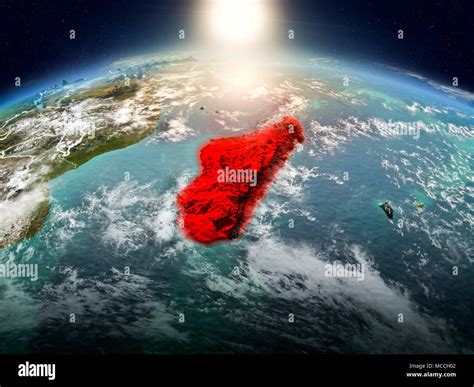 Sunrise Above Madagascar Highlighted In Red On Model Of Planet Earth In