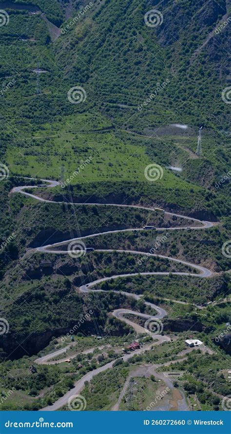 Gorgeous Aerial View Of A Zigzag Road In The Countryside Surrounded By