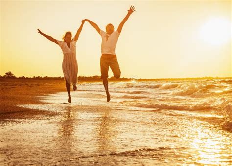 Happy Couple Running On The Beach Stock Image Image Of Honeymoon