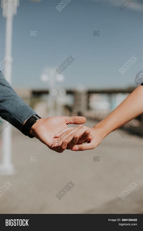 Girl And Guy Holding Hands