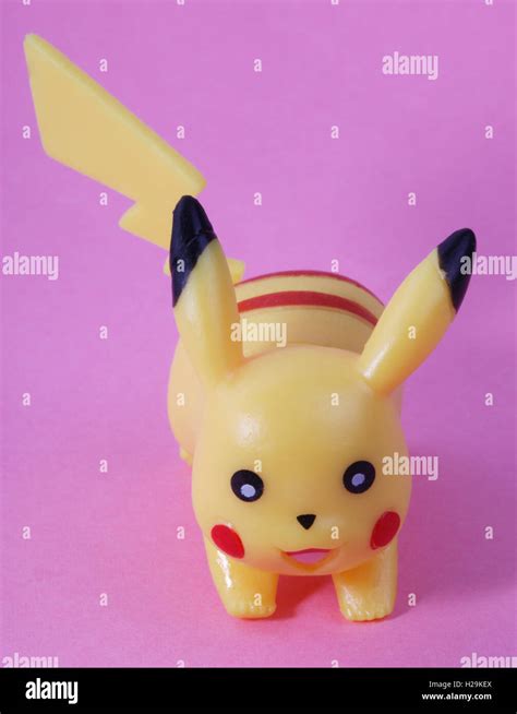 plastic toy on pink background Stock Photo - Alamy