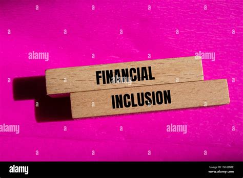 Financial Inclusion Message Written On Wooden Blocks With Pink