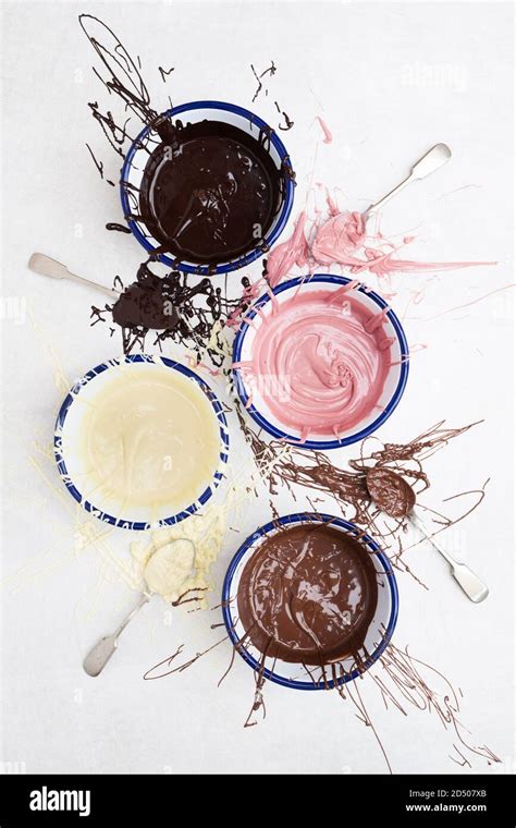 Four Types Of Melted Chocolate In Bowls Dark Chocolate Milk Chocolate White Chocolate And