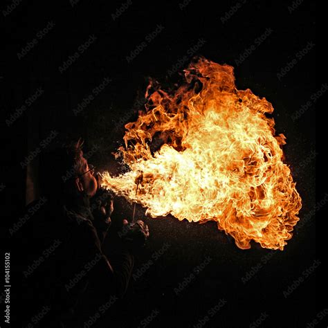 Fire artist performing fire breathing Stock Photo | Adobe Stock