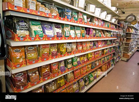 Asian Indian supermarket with shelves of spices in packets in bristol ...