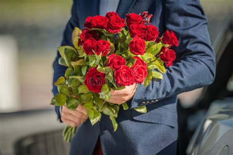 Men with Flowers Bouquet stock image. Image of handsome - 157102855