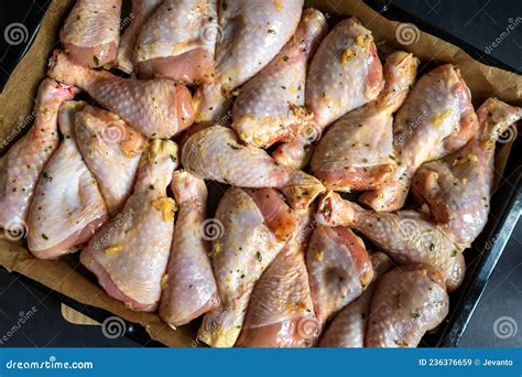 Raw Chicken Drumsticks On Baking Tray Prepared For Oven Stock Image