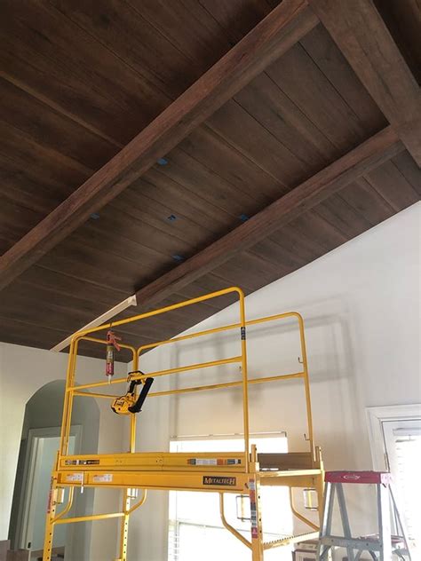 Vaulted ceiling beams with laminate wood - Jenna Sue Design