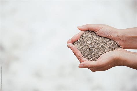 Hands Holding Sand By Stocksy Contributor CACTUS Creative Studio