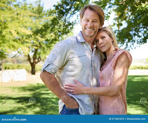 Pure Bliss At The Park An Affectionate Mature Couple Enjoying A Day In