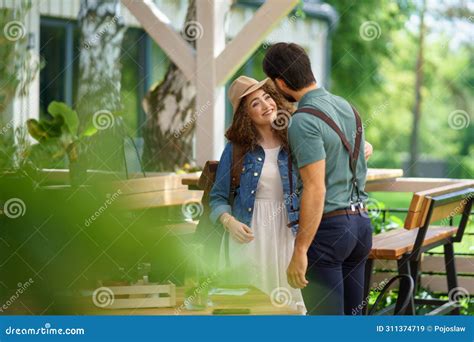 Friends Meeting At A Restaurant Terrace Greeting Hugging After Long