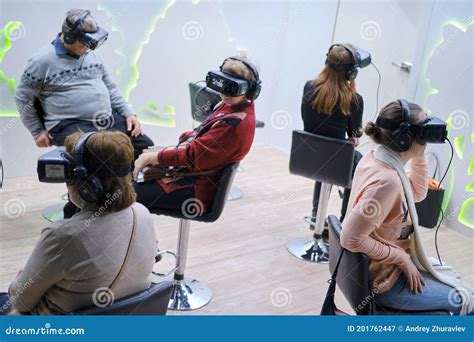 Men And Women Wearing Oculus Rift Gear Vr Virtual Reality Helmet