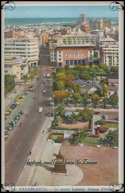 An Aerial View Of A City With Tall Buildings And Palm Trees In The