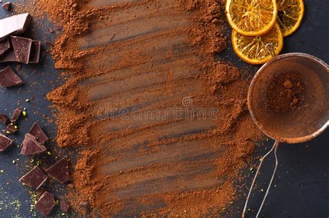 Cocoa Powder In A Sieve Over Black Slate Background Stock Photo Image