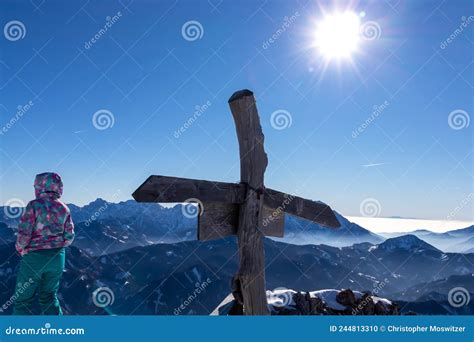 Active Woman With Scenic View From The Summit Cross Of Hochobir On