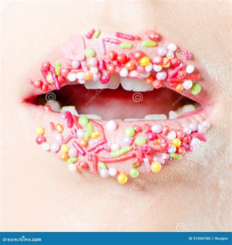 Closeup On Female Sweet Candy Lips With Licking Tongue Stock Photo