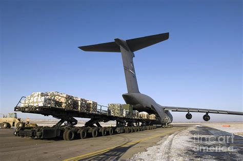 Pallets Await Loading Onto A C 5 Galaxy Photograph By Stocktrek Images