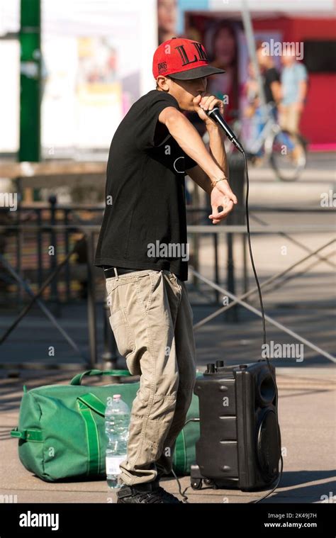 A Boy Beatbox Performs In A Street Of The City Center Of Milan The