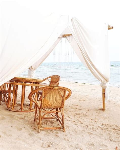 Premium Photo Deck Chairs On Beach Against Sky