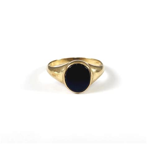 Damenring mit Onyx, 10 Karat Gelbgold | Badisches Auktionshaus
