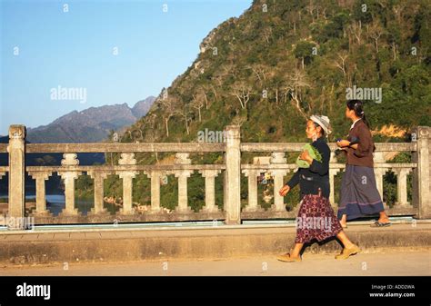 Women Walking Across Bridge Stock Photo Alamy