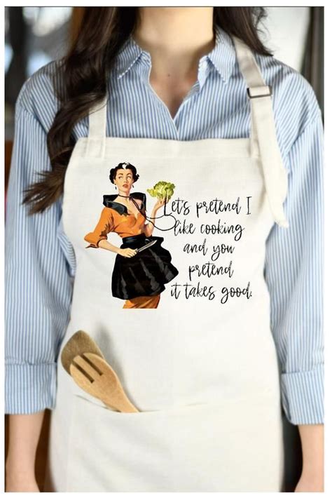 A Woman Wearing An Apron Holding A Wooden Spatula