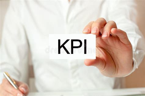 Kpi Key Performance Indicator Text On Cube Blocks In Businessman Hands