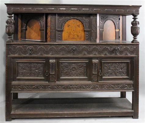 Lot JACOBEAN STYLE CARVED AND INLAID OAK COURT CUPBOARD