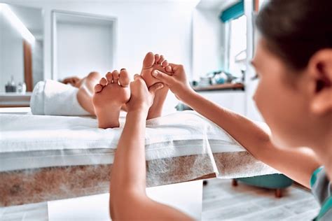 Premium Photo Woman Getting Feet Massage In The Spa Salon Selective Focus