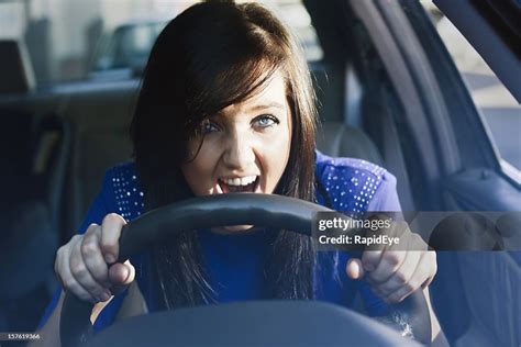 Woman Grips Steering Wheel And Yells In Fear Or Frustration High-Res Stock Photo - Getty Images